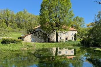 A lovely 4 bedroom mill house with outbuildings, lake and land